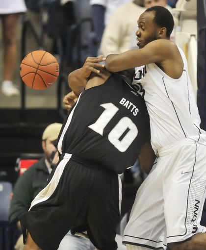 Kadeem Batts (L) loses control of a UConn rebound under pressure from Charles Okwandu during the first half of UConn's 75-57 win.