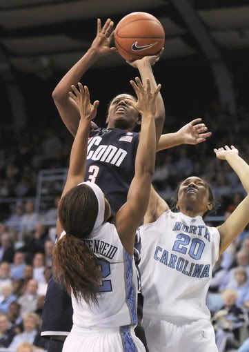 Tiffany Hayes shoots over Laura Broofield and Clay Shegog in the 1st half