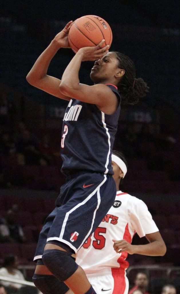 Connecticut’s Tiffany Hayes (3) drives past St. John’s Shenneika Smith (35) during the second half of an NCAA college basketball game, Wednesday, Jan. 12, 2011, in New York. Hayes scored 21 points in their 84-52 win.