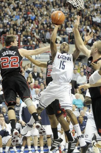 The University of Connecticut's Kemba Walker misses a jumper in traffic against Louisville in their Big East game at Gampel Pavilion. Walker scored 20 points in UConn's heartbreak one-point loss in triple overtime, 79-78. 