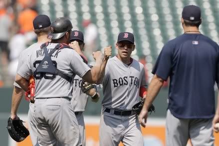 Jacoby Ellsbury #2 of the Boston Red Sox (C) celebrates with catcher Jason Varitek #33 after the Red Sox defeated the Baltimore Orioles 4-0 at Oriole Park at Camden Yards on July 20, 2011 in Baltimore, Maryland.