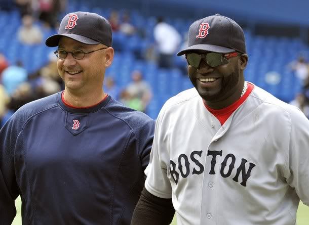 Boston Red Sox manager Terry Francona (L) and David Ortiz walk off the field after defeating the Toronto Blue Jays during the ninth inning of their MLB American League baseball game in Toronto June 12, 2011.