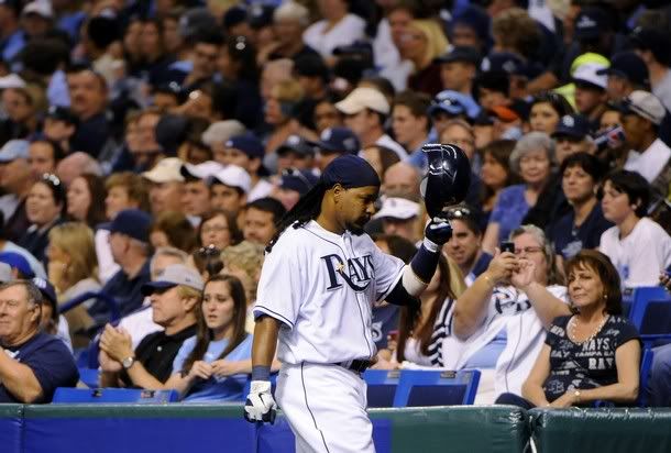 Tampa Bay Rays' Manny Ramirez walks back to the dugout after grounding to the shortstop during the seventh inning of their MLB American League baseball game against the Baltimore Orioles in St. Petersburg, Florida, in this April 1, 2011 file photo. Ramirez, a 12-times All-Star who won two World Series titles with the Boston Red Sox, has announced his retirement, Major League Baseball said on April 8, 2011. Ramirez, who was suspended 50 games in 2009 for violating the league's drug policy, was recently informed by Major League Baseball that there was an issue relating to the policy.