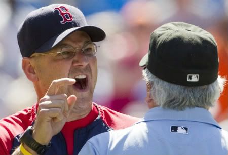 Boston Red Sox manager Terry Francona argues with umpire Larry Vanover (R) during a break in play against the Toronto Blue Jays during the seventh inning of their MLB American League baseball game in Toronto, in this file image from July 10, 2010. 