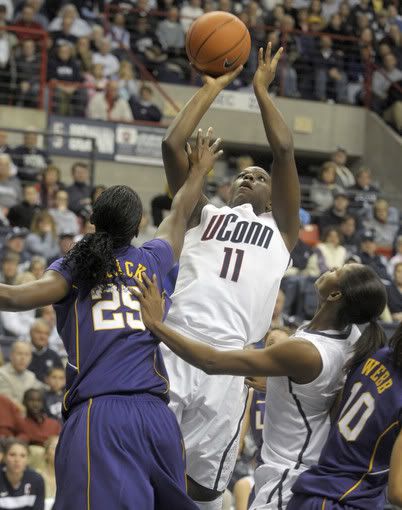 UConn's Samarie Walker takes a shot over LSU defender Swayze Black during the second half of the Huskies' 81-51 win in the final game of the World Vision Challenge at Gamepl Pavilion on Nov. 28, 2010.
