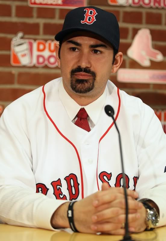 Adrian Gonzalez(notes) answers questions during a press conference to announce his signing with the Boston Red Sox on December 6, 2010 at Fenway Park in Boston, Massachusetts