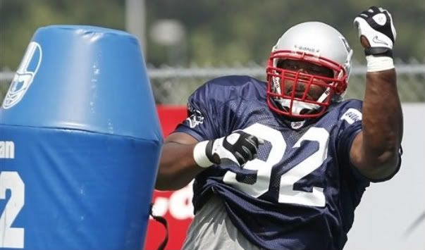 New England Patriots' Albert Haynesworth takes on a blocking dummy during NFL football training camp in Foxborough, Mass. Tuesday, Aug. 2, 2011.