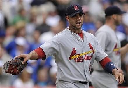 St. Louis Cardinals' Albert Pujols yells at first base umpire Dan Bellino after Chicago Cubs' Kosuke Fukudome scored on a throwing error by St. Louis Cardinals catcher Bryan Anderson in the third inning during a baseball game in Chicago, Saturday, Sept. 25, 2010.