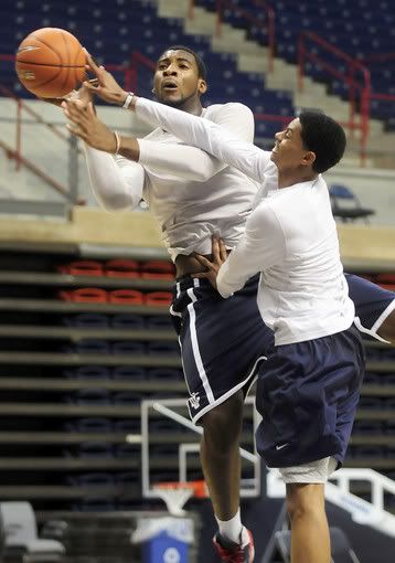 Andre Drummond is fouled by Jeremy Lamb during a pickup game after the annual Husky Fun Run Wednesday afternoon. The run kicks off the UConn men's basketball season. 