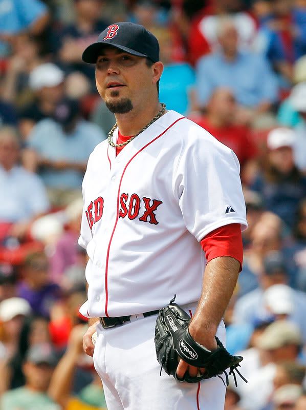 Josh Beckett(notes) #19 of the Boston Red Sox reacts against the Kansas City Royals at Fenway Park on July 28, 2011 in Boston, Massachusetts. 