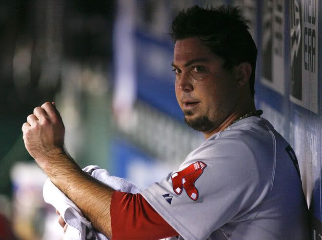 Starting pitcher Josh Beckett(notes) #19 of the Boston Red Sox wipes down his arm in the dugout during a game against the Kansas City Royals in the seventh inning at Kauffman Stadium on August 18, 2011 in Kansas City, Missouri. 
