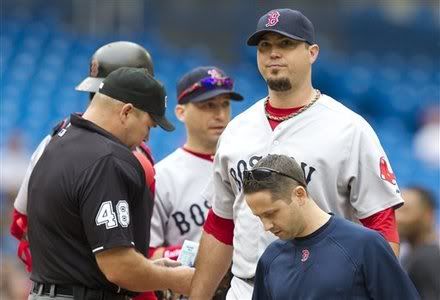 Boston Red Sox starting pitcher Josh Beckett(notes), right, leaves the game with an undisclosed injury during fourth inning of a baseball game against the Toronto Blue Jays in Toronto Monday, Sept. 5, 2011.