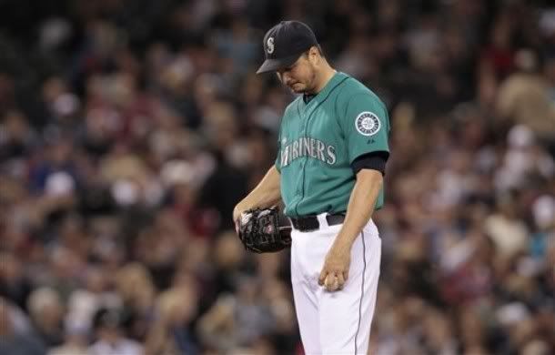 Seattle Mariners starting pitcher Erik Bedard waits for a new batter after giving up a 2-run home run to Atlanta Braves' Freddie Freeman in the seventh inning of a baseball game Monday, June 27, 2011, in Seattle.