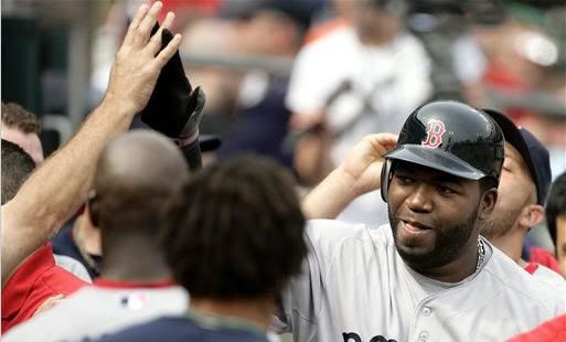 Boston Red Sox's David Ortiz, right, is congratulated in the dugout after hitting a solo home run in the ninth inning of the first baseball game of a doubleheader on Sunday, May 29, 2011, in Detroit.