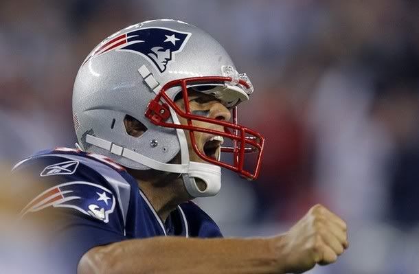 New England Patriots quarterback Tom Brady reacts after the Patriots scored a touchdown against the San Diego Chargers in the fourth quarter of their NFL football game in Foxborough, Massachusetts September 18, 2011.