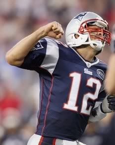 Tom Brady #12 of the New England Patriots celebrates his touchdown pass to Rob Gronkowski in the fourth quarter against the San Diego Chargers on September 18, 2011 at Gillette Stadium in Foxboro, Massachusetts.