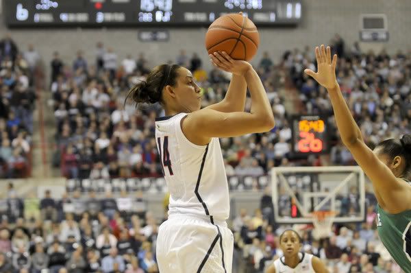 Bria Hartley, who led UConn with 14 points at the half, shoots over Notre Dame's Skylar Diggins. Hartley finished with a game-high 29. 