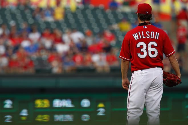 C.J. Wilson(notes) #36 of the Texas Rangers prepares to pitch against the Boston Red Sox at Rangers Ballpark in Arlington on August 22, 2011 in Arlington, Texas.