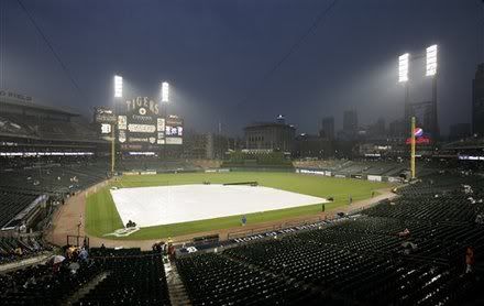 Fans sit in the stands during a rain delay in a baseball game between the Detroit Tigers and the Boston Red Sox, Saturday, May 28, 2011, in Detroit. The game was called and has been rescheduled as a day/night doubleheader on Sunday.