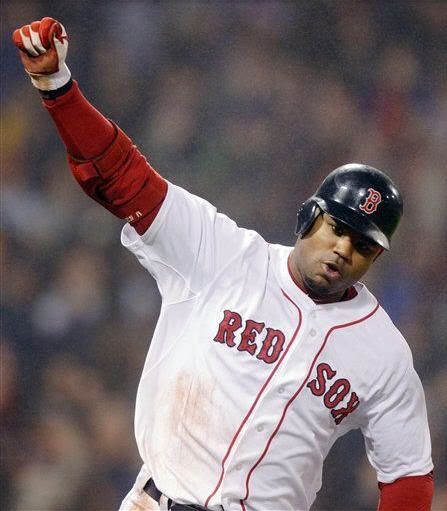 Boston Red Sox's Carl Crawford pumps his fist after his game-winning, bases-loaded single in the bottom of the ninth inning against the Detroit Tigers during an MLB baseball game at Fenway Park in Boston, Thursday, May 19, 2011. The Red Sox won 4-3.