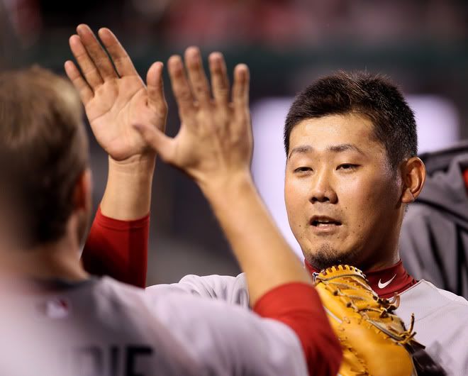 Daisuke Matsuzaka(notes) #18 of the Boston Red Sox is greeted by teammates in the dugout after he finished pitching the eighth inning against the Los Angeles Angels of Anaheim on April 23, 2011 at Angel Stadium in Anaheim, California.
