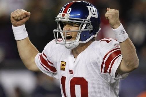 New York Giants quarterback Eli Manning celebrates his touchdown pass to tight end Jake Ballard in the last minute of an NFL football game in Foxborough, Mass., Sunday, Nov. 6, 2011. 