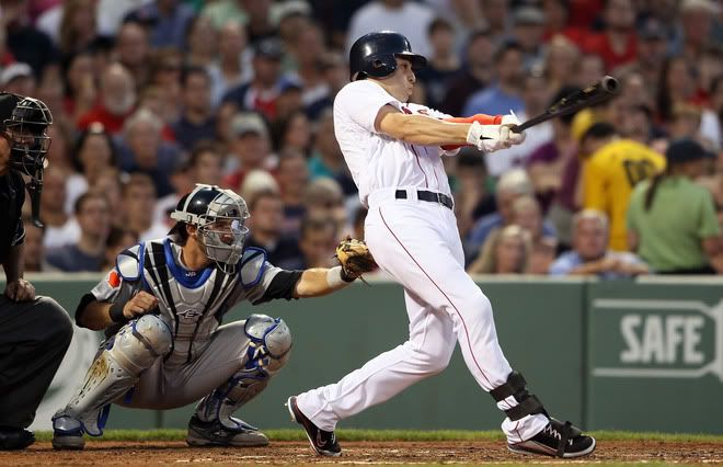: Jacoby Ellsbury(notes) #2 of the Boston Red Sox hits a 2 RBI double in the fourth inning as J.P. Arencibia(notes) #9 of the Toronto Blue Jays catches on July 6, 2011 at Fenway Park in Boston, Massachusetts