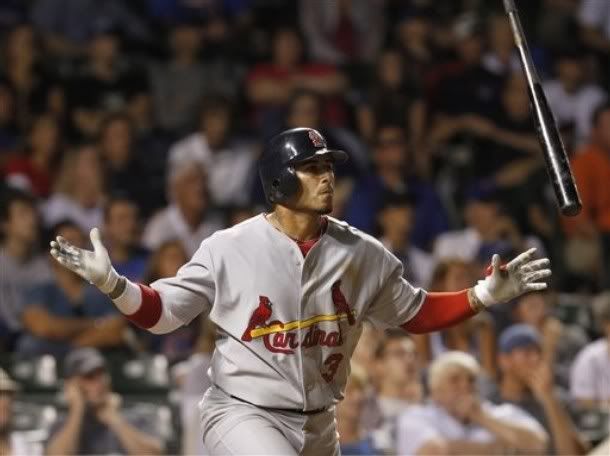 St. Louis Cardinals' Felipe Lopez watches his solo home run against the Chicago Cubs during the 11th inning of a baseball game Sunday, July 25, 2010, in Chicago.