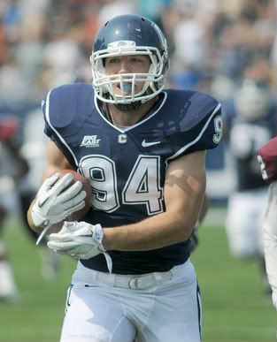 UConn's Ryan Griffin (No. 94) runs the ball into the end zone for a UConn touchdown during the first half of UConn football opener at Rentschler Field against Fordham on Saturday. 