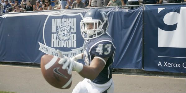 UConn's Lyle McCombs (No. 43) celebrates near the end zone after scoring yet another UConn touchdown during the second half of UConn football opener at Rentschler Field against Fordham on Saturday. UConn won 35-3. 