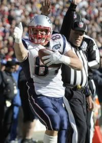 New England Patriots tight end Rob Gronkowski (87) signals a first down after a catch against the Washington Redskins during the first half of their NFL football game in Landover, Maryland, December 11, 2011.