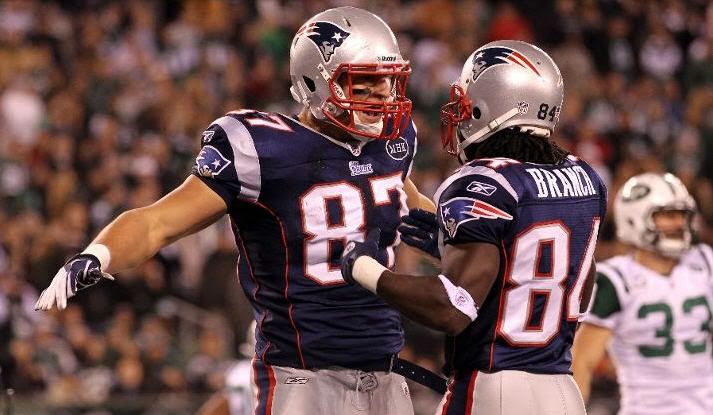 Rob Gronkowski #87 of the New England Patriots celebrates with Deion Branch #84 after scoring a touchdown late in the second quarter against the New York Jets at MetLife Stadium on November 13, 2011 in East Rutherford, New Jersey.