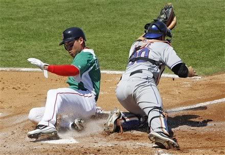 Boston Red Sox base runner Jacoby Ellsbury(notes), left, scores on a two-run single by teammate Carl Crawford(notes) as New York Mets catcher Josh Thole(notes), right, reaches for the ball in the third inning of a spring training baseball game on St. Patrick's Day in Fort Myers, Fla., Thursday, March 17, 2011