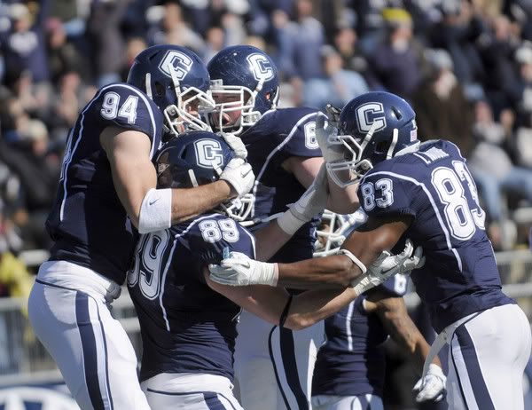 UConn celebrates after John Delahunt (89) scores a touchdown in the opening minutes of the game. 