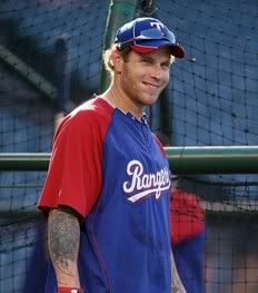 Josh Hamilton #32 of the Texas Rangers warms up before the game against the Los Angeles Angels of Anaheim at Anaheim Stadium on July 1, 2010 in Anaheim, California.