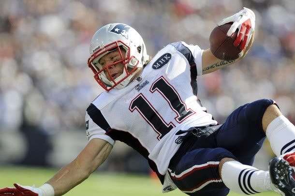 New England Patriots wide receiver Julian Edelman is flipped through the air on a tackle, against the Buffalo Bills in the third quarter of their NFL football game in Orchard Park, New York September 25, 2011.