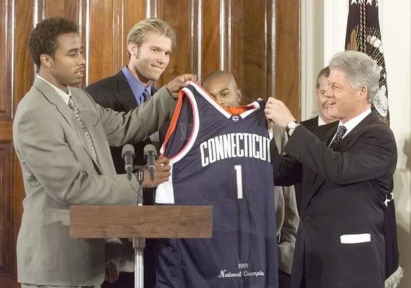 Kevin Freeman, left, and Jake Voskuhl presented President Bill Clinton with a UConn jersey duing a White House visit in 1999.