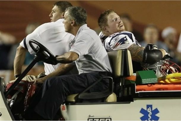 New England Patriots center Dan Koppen leaves the field on a cart after an injury to his left ankle during the second quarter of an NFL football game against the Miami Dolphins, Monday, Sept. 12, 2011 in Miami.