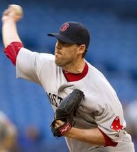 Boston Red Sox starting pitcher John Lackey(notes) pitches to the Toronto Blue Jays during the third inning of a baseball game in Toronto on Wednesday, May 11, 2011.