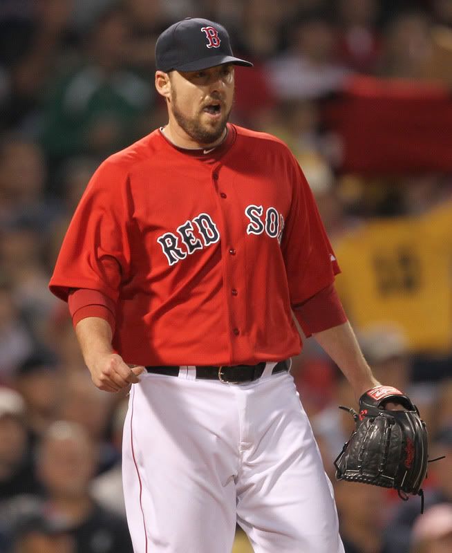 John Lackey(notes) #41 of the Boston Red Sox reacts in the third inning against the Milwaukee Brewers at Fenway Park on June 17, 2011 in Boston, Massachusetts.