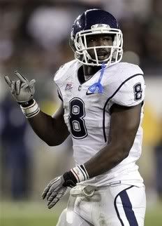 Connecticut linebacker Lawrence Wilson (8) reacts after intercepting a South Florida second-quarter pass and returning it for a touchdown during an NCAA college football game Saturday, Dec. 4, 2010, in Tampa, Fla.