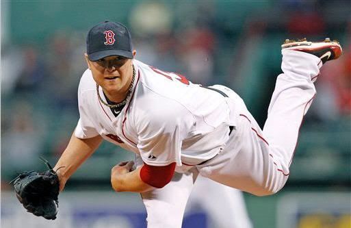 Boston Red Sox starting pitcher Jon Lester watches a delivery to the Los Angeles Angels during the first inning of a baseball game at Fenway Park in Boston on Tuesday, May 3, 2011.