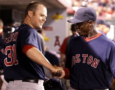 Boston Red Sox starting pitcher Jon Lester(notes), left, shakes hands with outfielder Mike Cameron(notes), right, after the sixth inning of a baseball game against the Los Angeles Angels, Friday, April 22, 2011, in Anaheim, Calif.