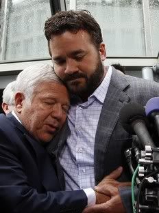 New England Patriots team owner Robert Kraft (L) gets a hug from Indianapolis Colts center Jeff Saturday outside the NFL Players Association Headquarters in Washington July 25, 2011.