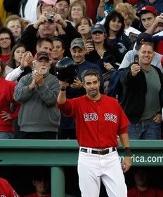 Mike Lowell #25 of the Boston Red Sox reacts to the applause after he was replaced by a pinch runner in the fifth inning during the first game of a doubleheader against the New York Yankees at Fenway Park October 2, 2010 in Boston, Massachusetts. Lowell will retire after the 2010 season.