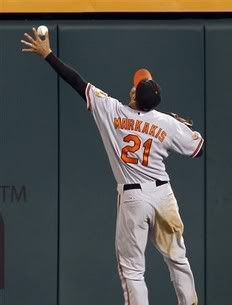 Baltimore Orioles right fielder Nick Markakis can't get to a ball hit by Los Angeles Angels' Mike Napoli for a double during the seventh inning of their baseball game in Anaheim, Calif. , Saturday, Aug. 28, 2010.