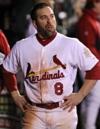 Nick Punto #8 of the St. Louis Cardinals looks on from the dugout during Game Six of the MLB World Series against the Texas Rangers at Busch Stadium on October 27, 2011 in St Louis, Missouri