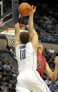 UConn's Tyler Olander goes up for a dunk and is rejected by his brother, Ryan, in the second half of the UConn/Fairfield game at the XL Center Thursday night. UConn won, 79-71.