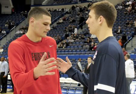 Ryan Olander, a center for Fairfield, greeted his brother, UConn center Tyler, at center court before the UConn/Fairfield game at the XL Center Thursday night. 