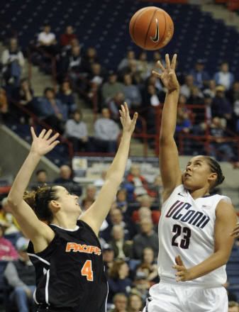 Connecticut's Kaleena Mosqueda-Lewis releases a shot while guarded by Pacific's Kendall Rodriguez in the second half of an NCAA college basketball game Storrs, Conn., Tuesday, Nov. 15, 2011.